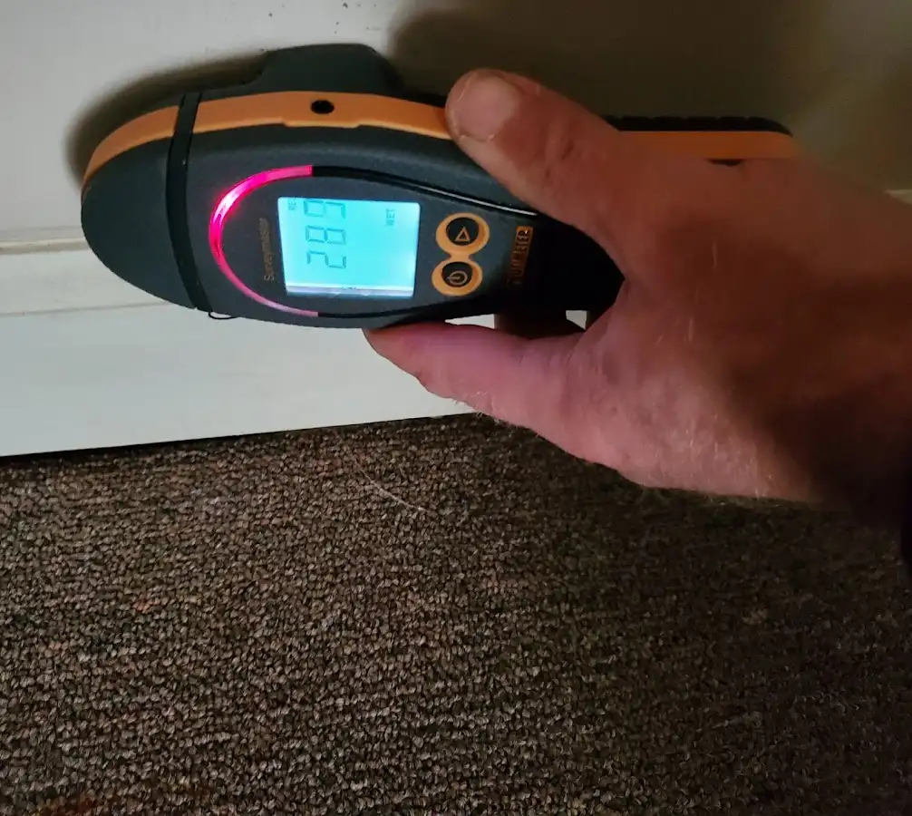 Moisture detection at baseboard during Storm Damage Restoration in Cumru